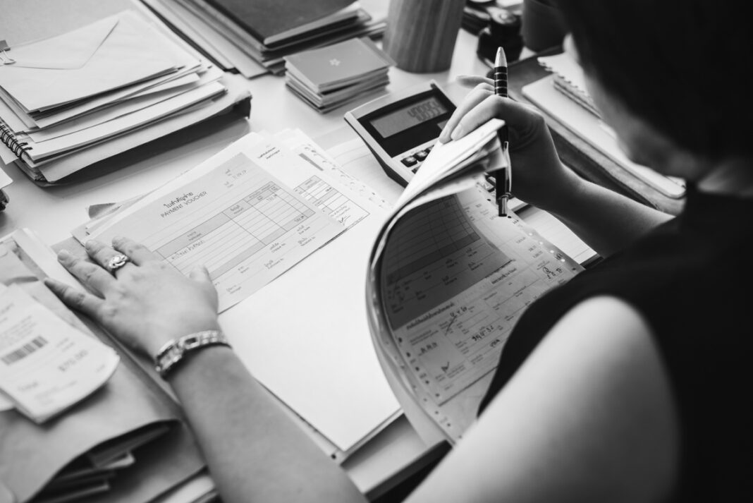 Woman working through paperwork