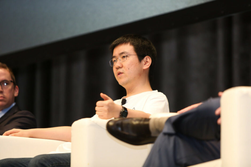 Jihan Wu, co-founder of Bitmain, speaking at a conference