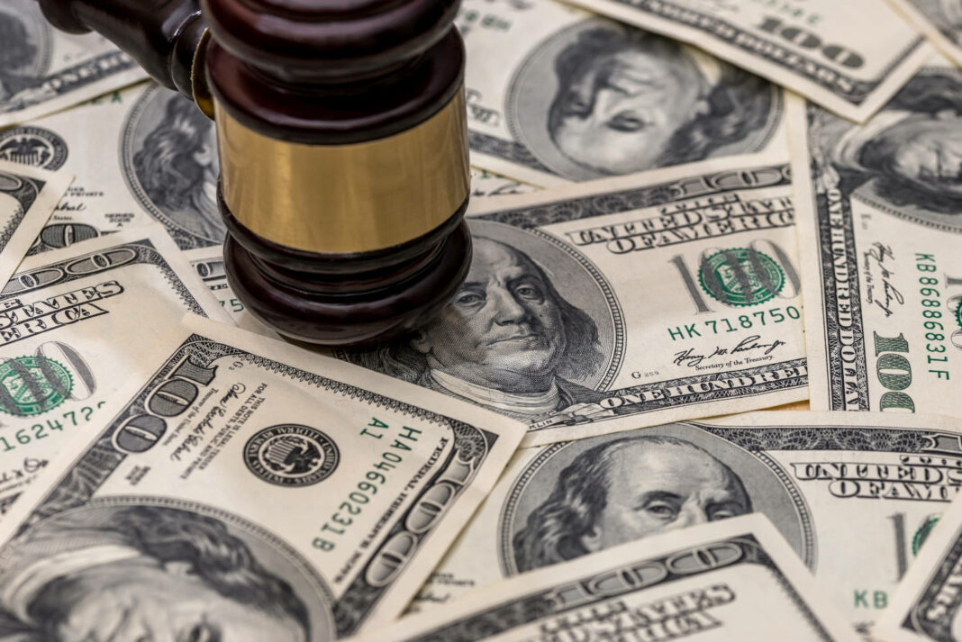 Gavel on top of US dollar bills