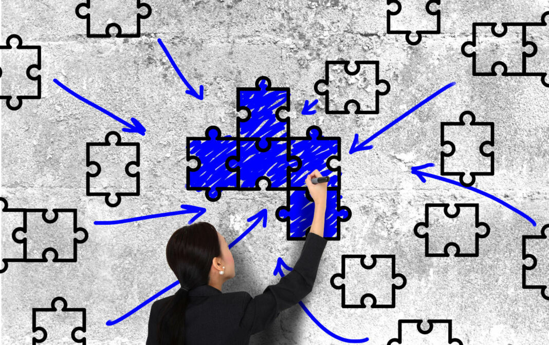 Woman drawing puzzle