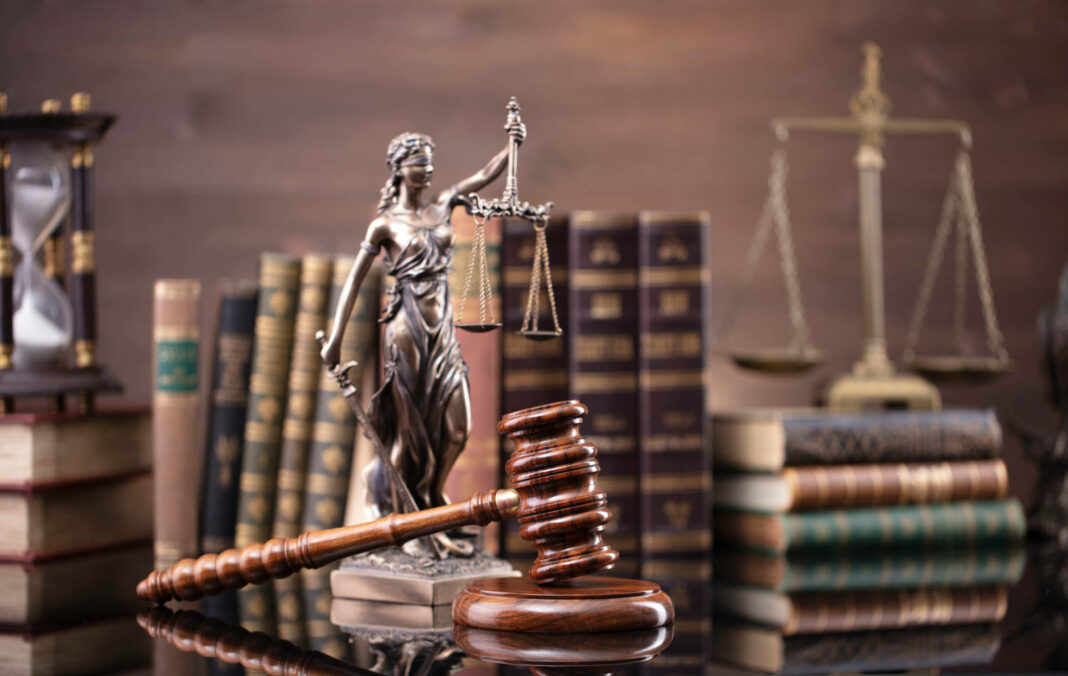 Justice symbols on glossy table