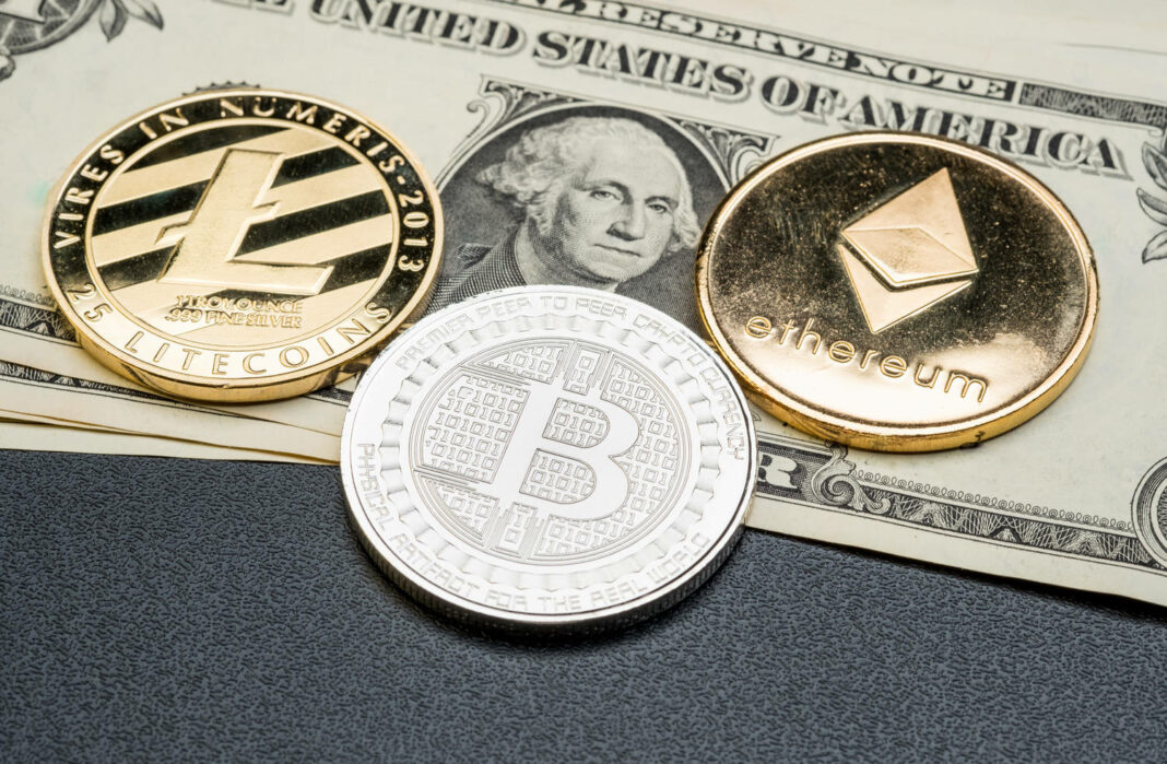 Silver and gold Bitcoin,litecoin,ethereum on dollar banknote
