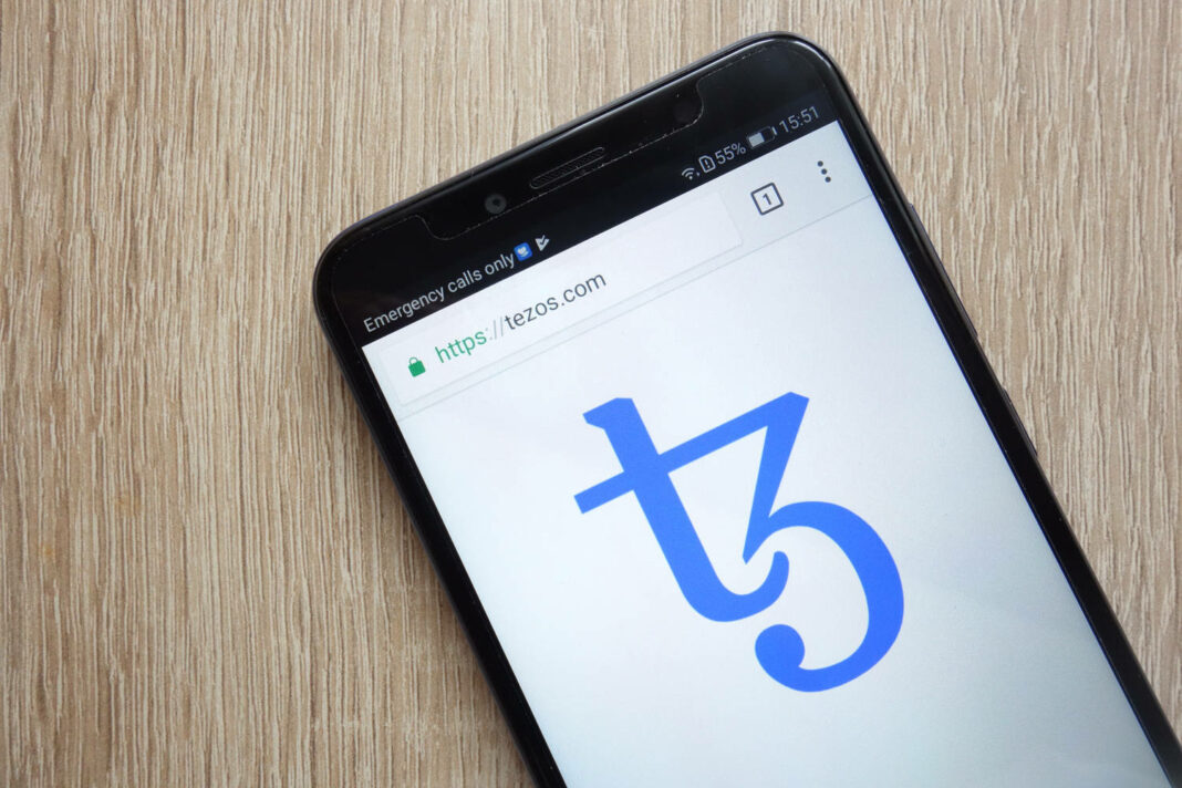 Tezos (XTZ) cryptocurrency website displayed on smartphone