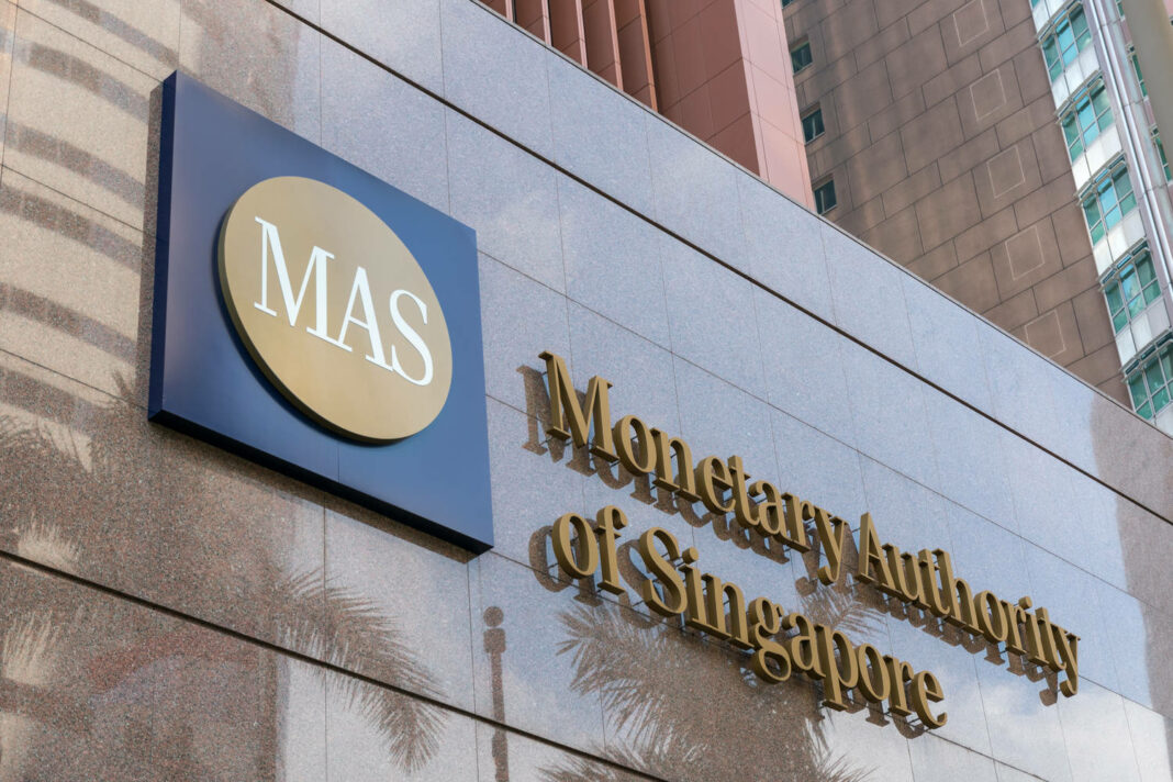 Monetary Authority of Singapore (MAS) logo signage on the building at entrance.