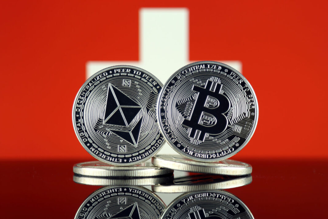 Physical version of Ethereum (ETH), Bitcoin (BTC) and Switzerland Flag